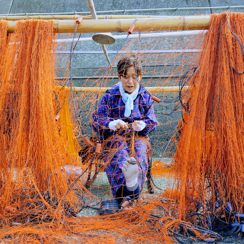 fixing fishing nets in ashizuri